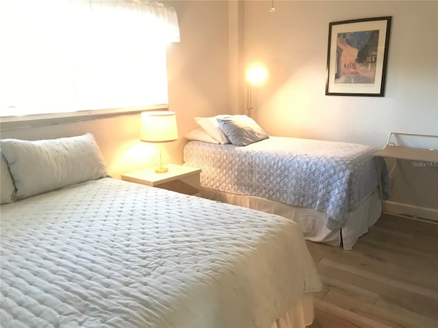 bedroom with hardwood / wood-style floors