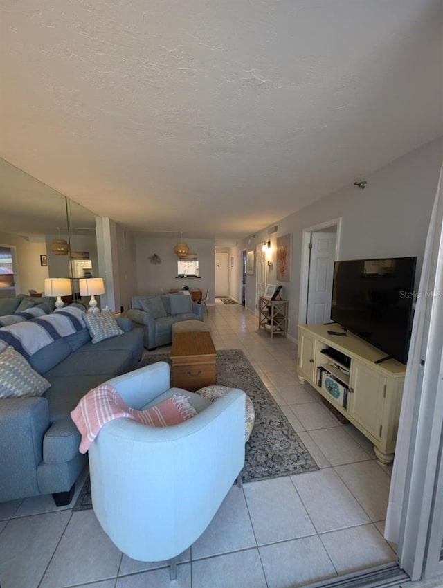 tiled living room with a textured ceiling