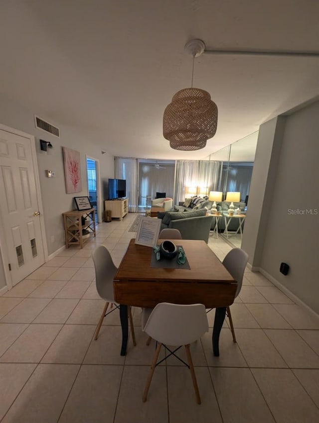 dining space with light tile patterned flooring