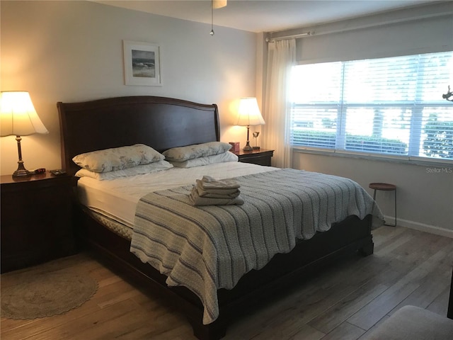 bedroom with hardwood / wood-style floors