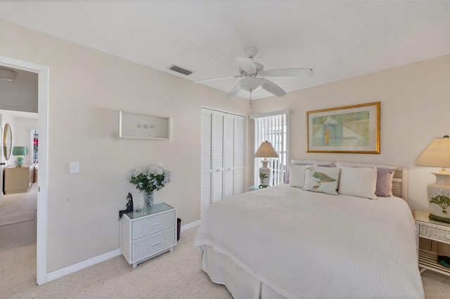 carpeted bedroom with a closet and ceiling fan