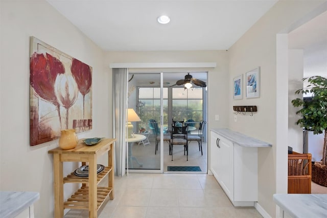 doorway featuring light tile patterned floors