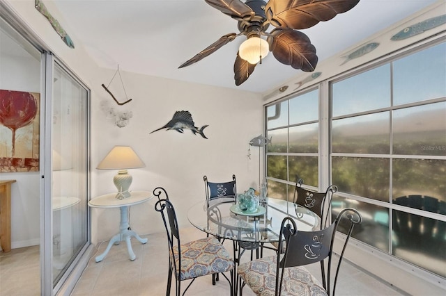 sunroom featuring ceiling fan