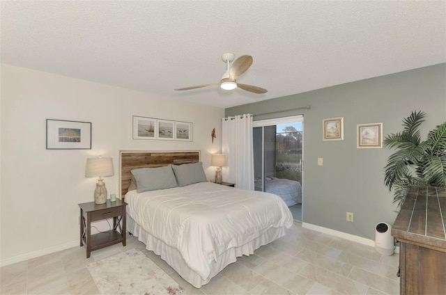 tiled bedroom featuring access to exterior, a textured ceiling, and ceiling fan