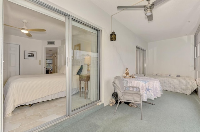 bedroom with ceiling fan and light colored carpet