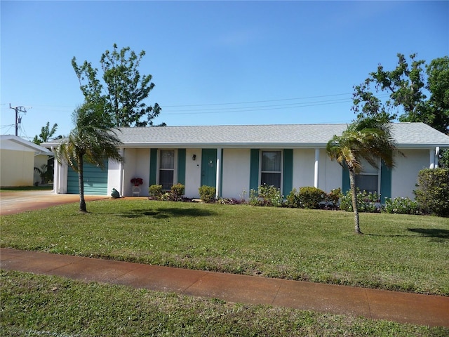 ranch-style home featuring a front yard