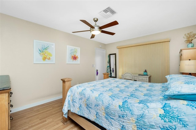 bedroom featuring light hardwood / wood-style floors and ceiling fan