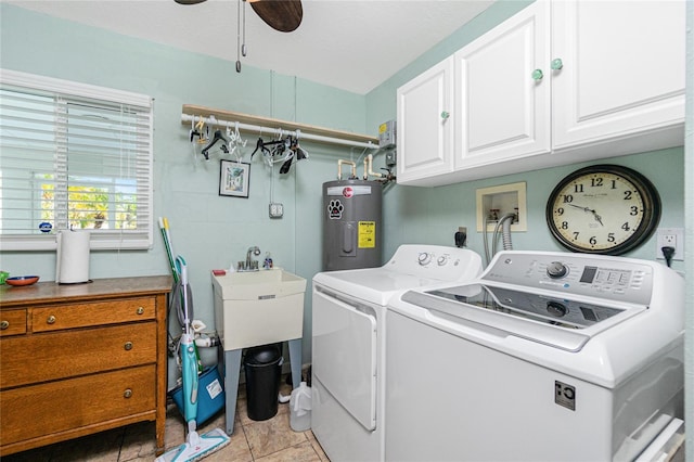 clothes washing area featuring cabinets, electric water heater, ceiling fan, independent washer and dryer, and light tile patterned flooring