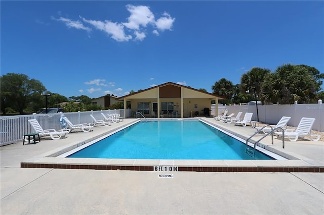 view of swimming pool featuring a patio