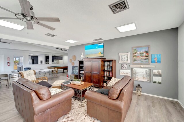 living room with ceiling fan, billiards, and light hardwood / wood-style flooring