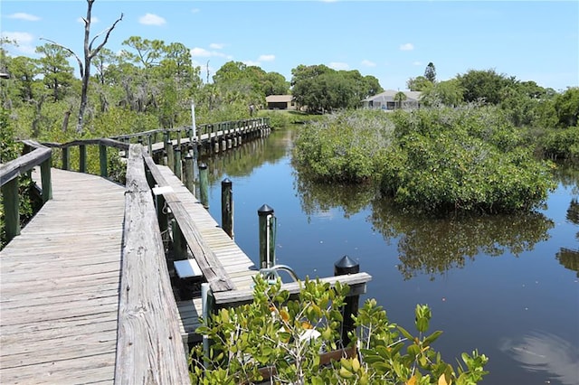 view of dock with a water view