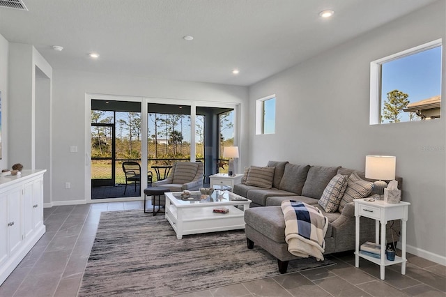 living room with dark tile patterned floors