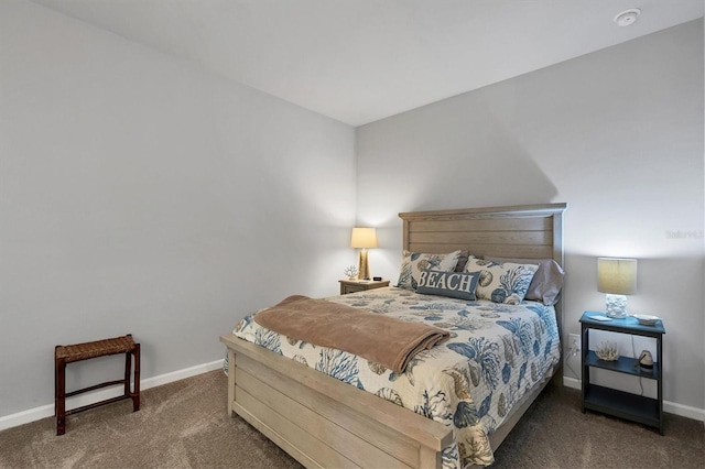 bedroom with dark colored carpet