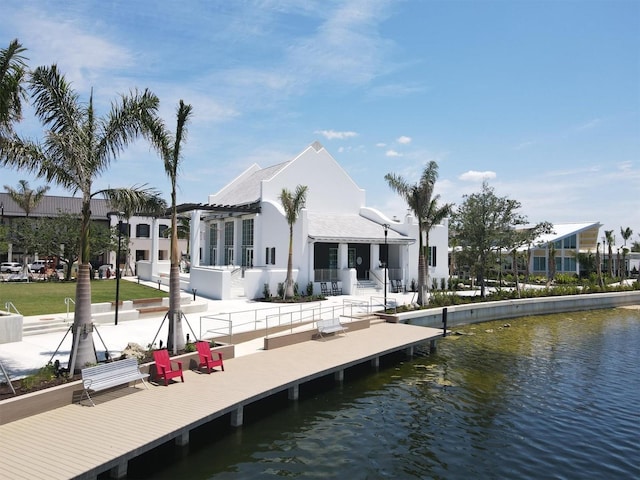 rear view of property with a water view