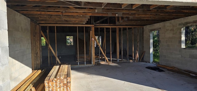 misc room featuring a healthy amount of sunlight and concrete floors