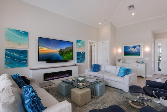 living room featuring high vaulted ceiling and ornamental molding