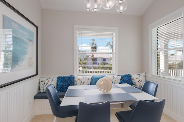 dining space featuring breakfast area, light hardwood / wood-style flooring, and plenty of natural light