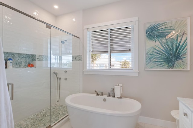 bathroom with independent shower and bath and vanity