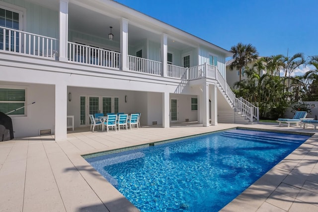 view of swimming pool with a patio