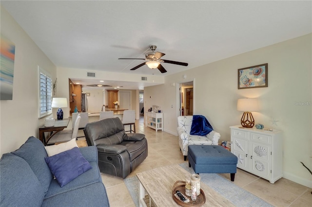 tiled living room featuring ceiling fan