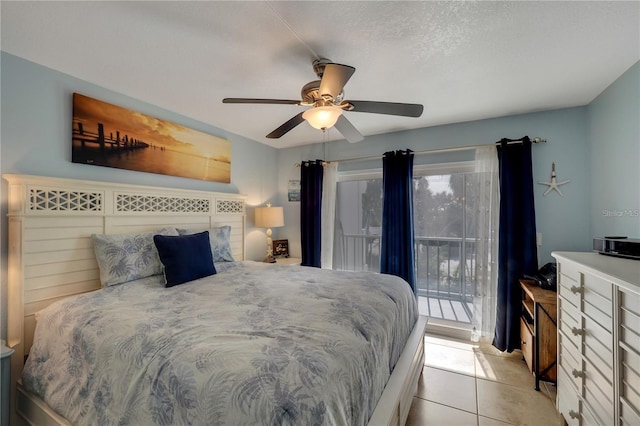 bedroom featuring a textured ceiling, light tile patterned flooring, ceiling fan, and access to exterior