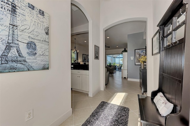 hallway with light tile patterned floors