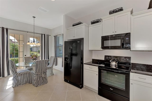 kitchen featuring white cabinetry, plenty of natural light, and black appliances