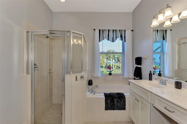 bathroom with separate shower and tub and vanity