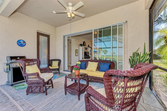 view of patio / terrace with area for grilling, ceiling fan, and an outdoor hangout area