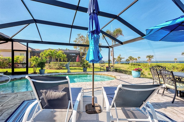 view of swimming pool with a lanai and a patio