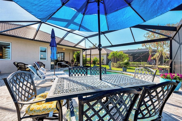 view of patio with a lanai