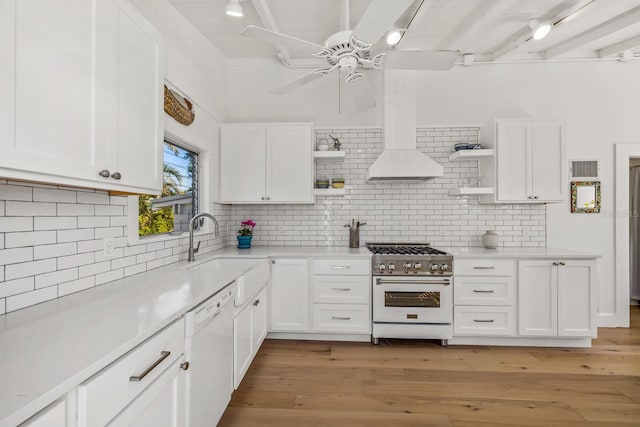 kitchen with white cabinetry, sink, dishwasher, and high end stainless steel range oven