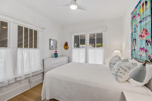 bedroom featuring wood-type flooring and ceiling fan