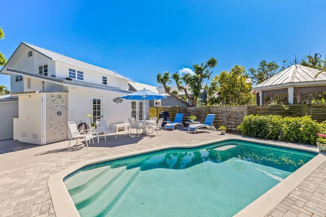 view of swimming pool featuring a patio