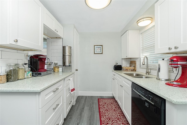 kitchen featuring dark hardwood / wood-style floors, decorative backsplash, white cabinets, black dishwasher, and sink