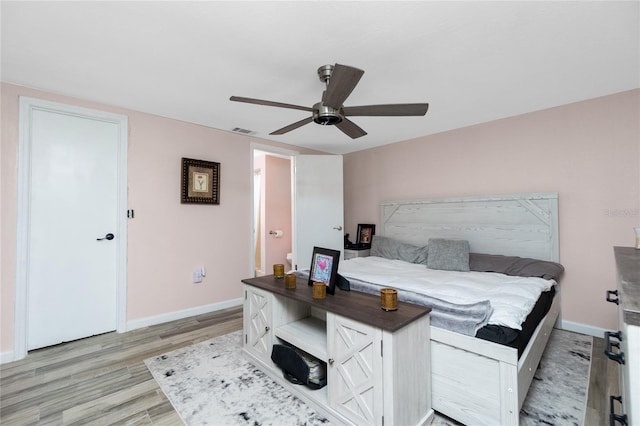 bedroom with light wood-type flooring and ceiling fan