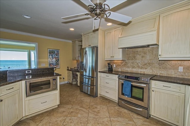 kitchen featuring stainless steel appliances, dark stone countertops, ornamental molding, custom exhaust hood, and backsplash