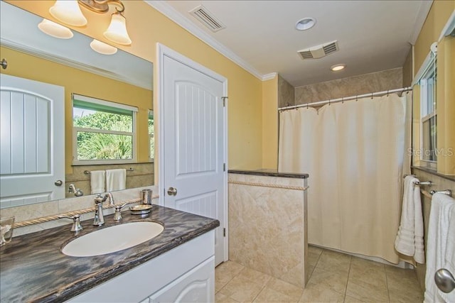 bathroom with tile patterned flooring, ornamental molding, a shower with shower curtain, and vanity