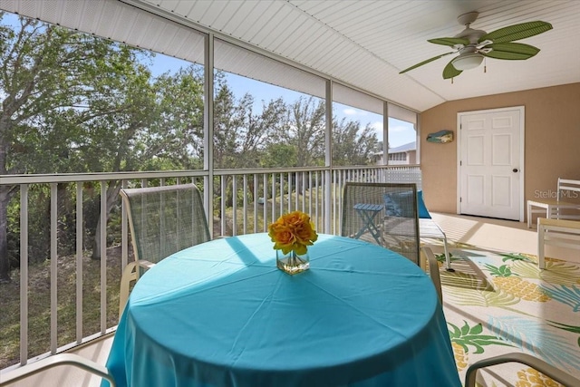 sunroom / solarium with ceiling fan