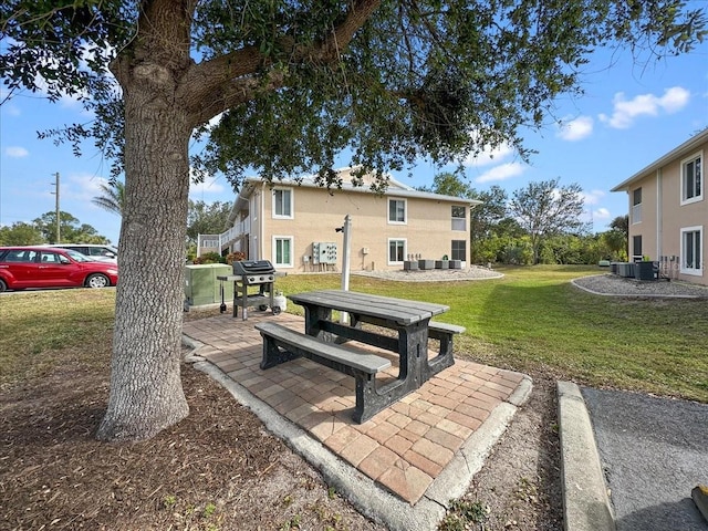 view of yard with a patio area and cooling unit