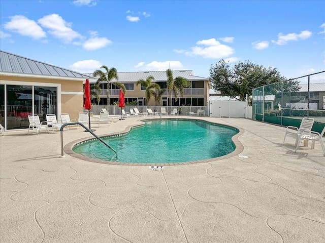 view of swimming pool with a patio