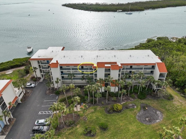 birds eye view of property featuring a water view