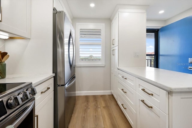 kitchen with stainless steel appliances and white cabinetry