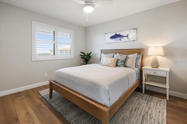 bedroom with ceiling fan and hardwood / wood-style flooring