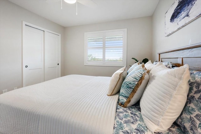 bedroom with ceiling fan and a closet