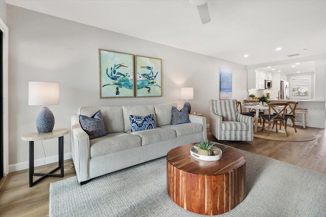 living room with light hardwood / wood-style flooring