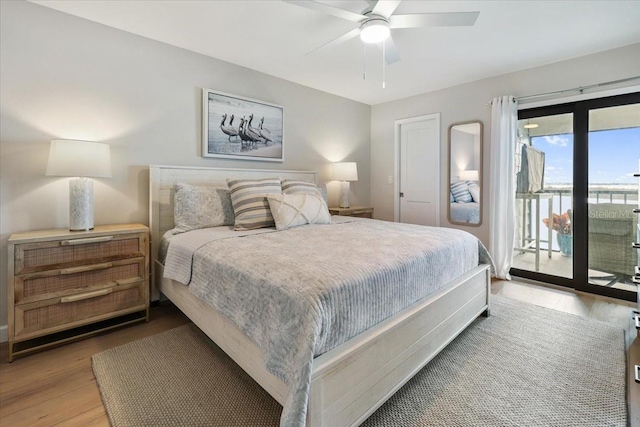 bedroom with light wood-type flooring, ceiling fan, and access to exterior