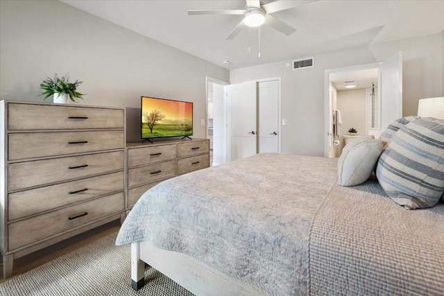 bedroom with ceiling fan and ensuite bathroom