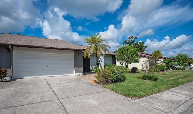 ranch-style home featuring a front lawn and a garage