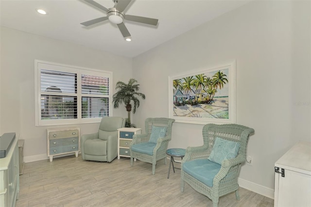 sitting room featuring ceiling fan and light wood-type flooring